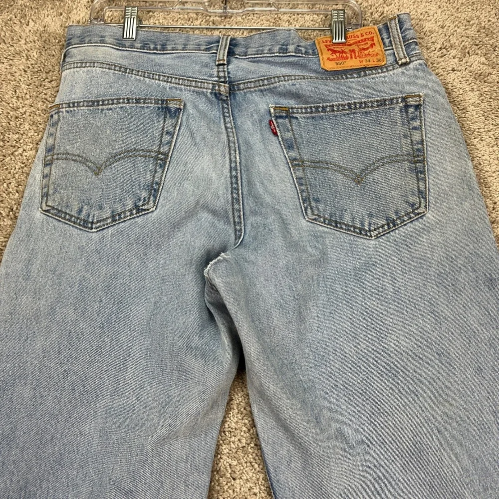 Levis 550 Jeans Mens 34x30 Light Wash Blue Straight Leg 5 Pocket Distressed FLAW